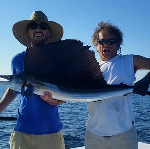 Couple with a sailfish caught off Destin